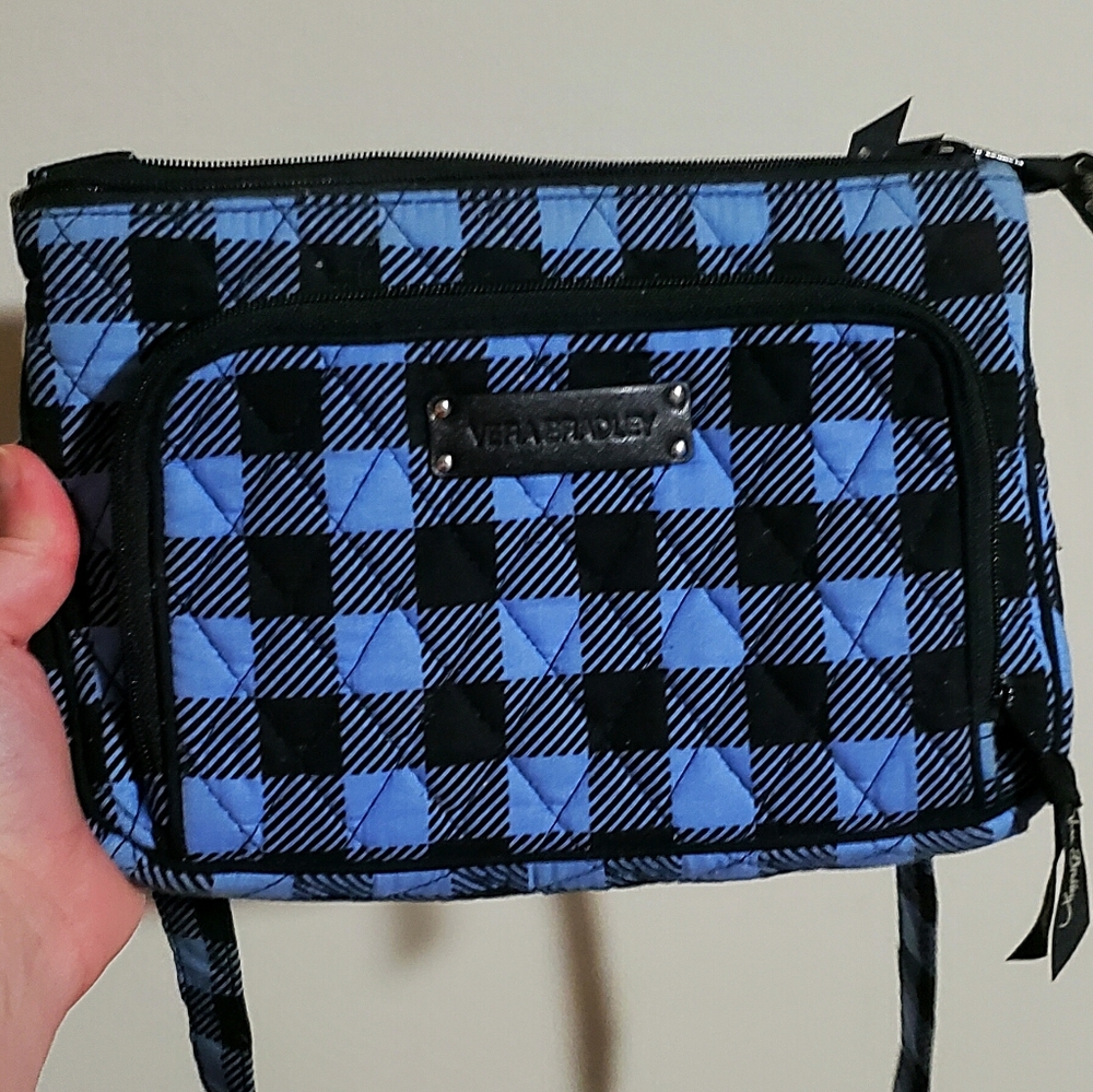 Blue/black checkered crossbody purse.